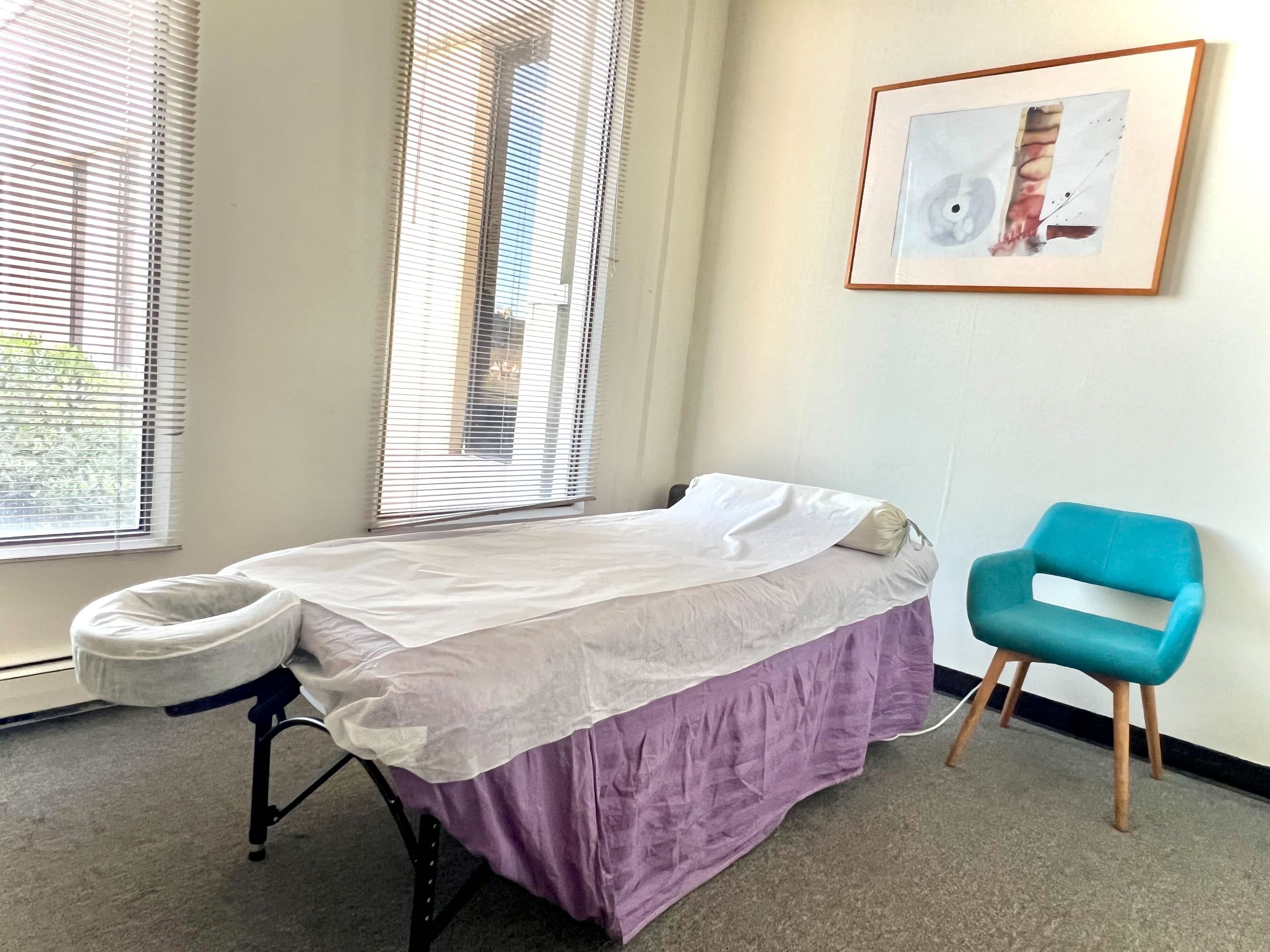 Private treatment room with a therapy table